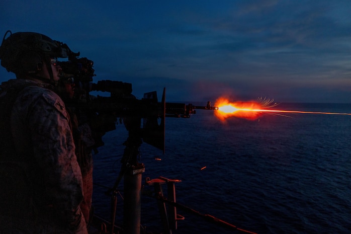 U.S. Marines with Echo Battery, Battalion Landing Team 3/5, 11th Marine Expeditionary Unit (MEU) conduct a live-fire exercise with a .50 caliber machine gun on the port bridge wing of San Antonio-class transport dock ship USS Portland (LPD 27), June 12, 2026.