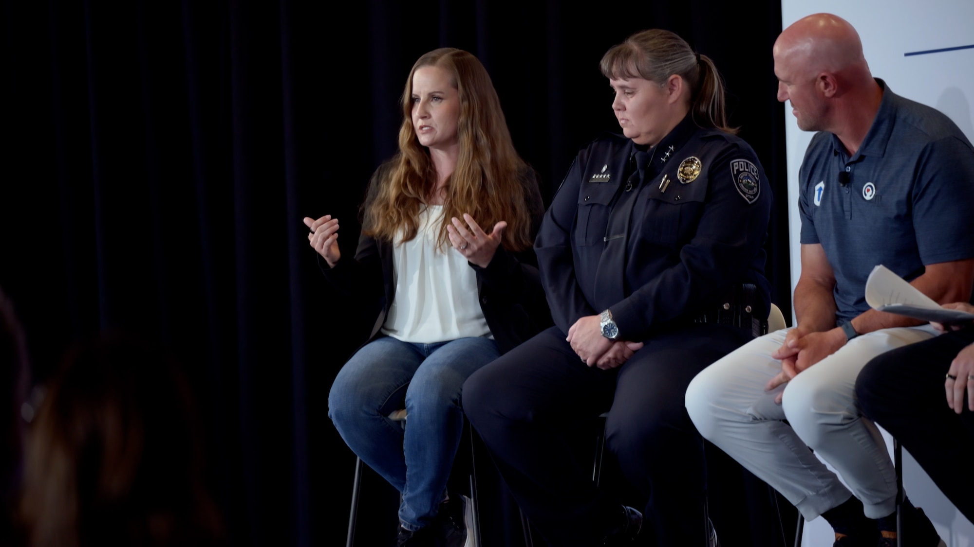 A close-up shot of Master Sergeant Rebecca Anderson speaking on a panel.
