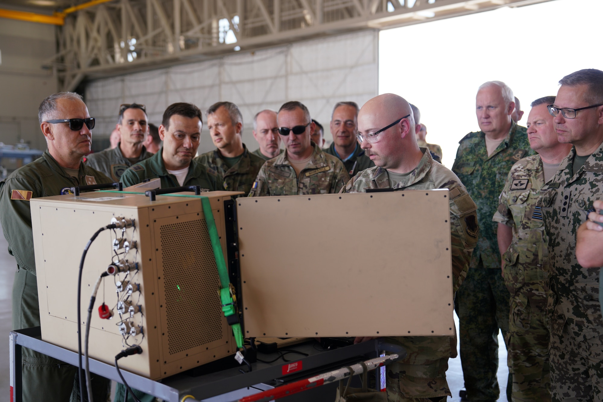Members of the International Air and Space Attachés observe a technical demonstration of MQ-9 sensors during an orientation tour at Creech Air Force Base, Nevada, June 12, 2026. One part of the attachés tour is interacting and seeing what MQ-9 pilots go through daily. (U.S. Air Force photo by Airman Vinh Phan)