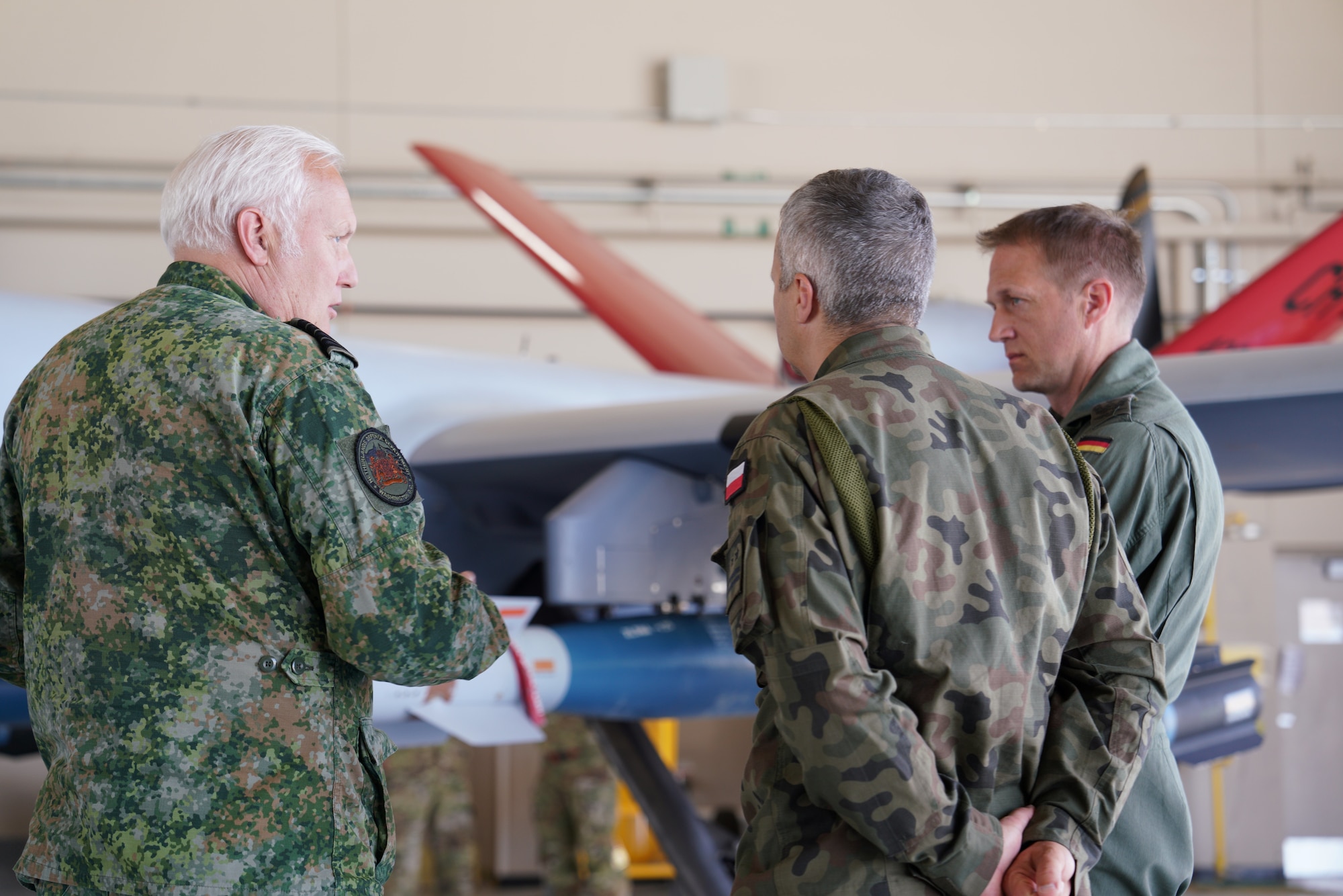 Members of the International Air and Space Attachés have discussions of the MQ-9 during a technical demonstration of the MQ-9 sensors at Creech Air Force Base, Nevada, June 12, 2026. Members of the 25th Attack Wing Leadership met with the attachés to demonstrate Creech’s mission capabilities. (U.S. Air Force photo by Airman Vinh Phan)