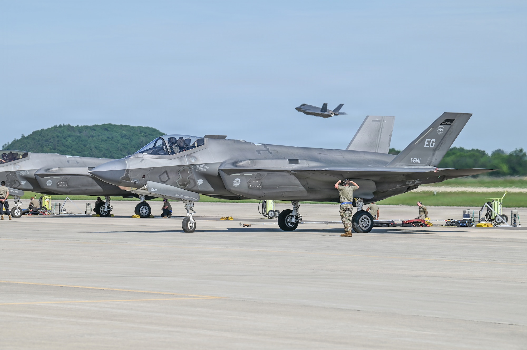 A U.S. Air Force tactical aircraft maintenance specialist assigned to the 33rd Fighter Wing, Florida Air National Guard, marshals an F-35A Lightning II aircraft for launch during Sentry North 2026 at Volk Field Combat Readiness Training Center, Camp Douglas, Wisconsin, June 4, 2026.