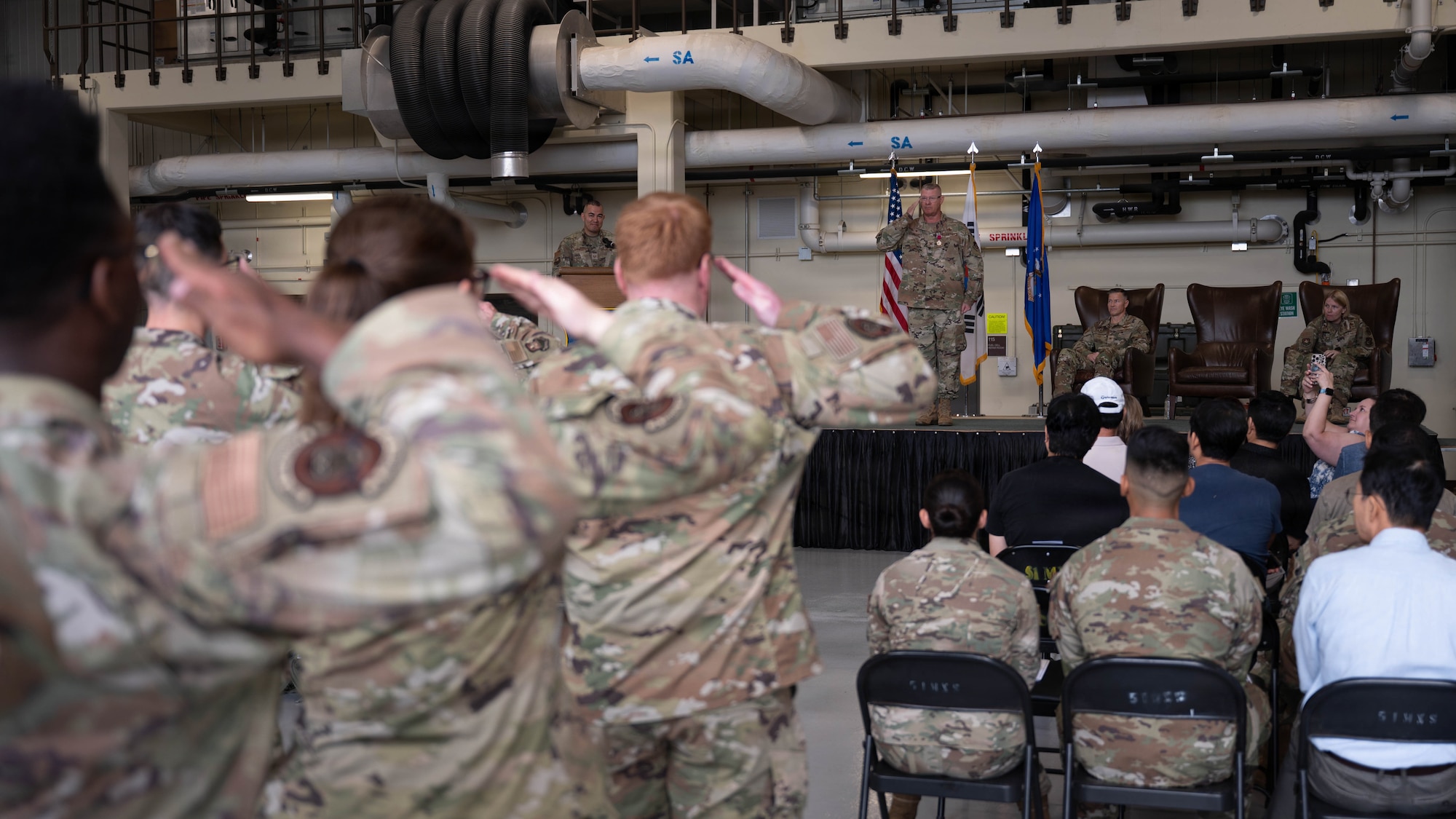Col. Kenneth Beebe, outgoing commander of the 51st Maintenance Group, renders his final salute to members of the 51st MXG during a change of command ceremony at Osan Air Base, Republic of Korea, June 8, 2026. The final salute recognizes the outgoing commander's service and marks the conclusion of their leadership of the 51st MXG. (U.S. Air Force photo by Senior Airman Rome Bowermaster)