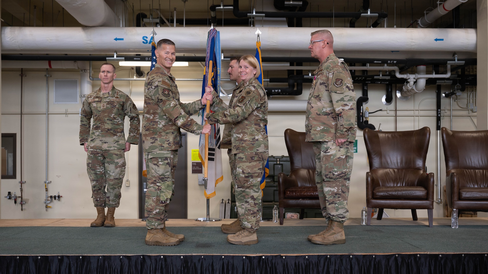 U.S. Air Force Col. Kristen Torma accepts command of the 51st Maintenance Group from Col. Ryan Ley, 51st Fighter Wing commander, during a change of command ceremony at Osan Air Base, Republic of Korea, June 8, 2026. 