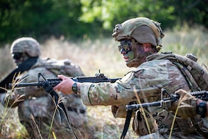U.S. Army Soldiers Spc. Renato Medina and Staff Sgt. Cody Merrifield, infantrymen with 1st Infantry Division, III Armored Corps, react to contact during the medical trauma evacuation lane at the IIIAC Best Squad Competition on June 3, 2026 at Fort Hood, Texas. The Army Best Squad Competition brings together top-performing Soldiers to compete in a series of demanding events designed to assess tactical competence, leadership, fitness, and squad cohesion. (U.S. Army photo by Sgt. 1st Class Thomas Calvert)