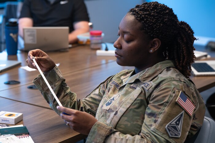 Image of a Guardian looking at a document