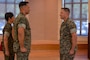 U.S. Marine Corps Sgt. Maj. Casey S. Chandler, outgoing senior enlisted leader for 2nd Network Battalion, Marine Corps Cyberspace Operations Group, holds the sword of office during a relief and appointment ceremony at Marine Corps Base Camp Lejeune, North Carolina, June 2, 2026. 2nd Network Bn held the ceremony to mark the transition of its senior enlisted leadership, signifying the transfer of all responsibilities and authorities between the outgoing and incoming sergeants major.  (U.S. Marine Corps Photo by Cpl. Jessica J. Mazzamuto)