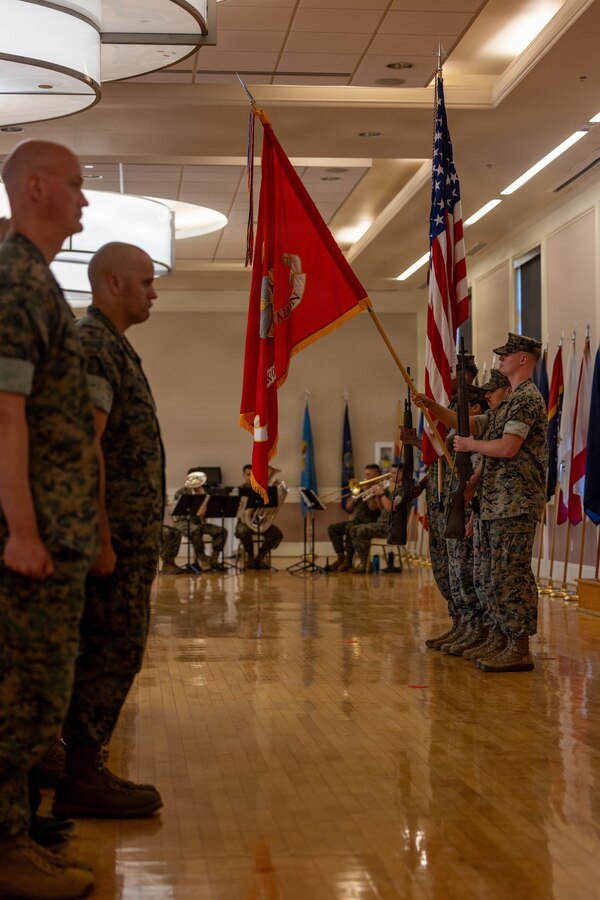 U.S. Marines with 2nd Network Battalion, Marine Corps Cyberspace Operations Group, march on the colors, during a relief and appointment ceremony at Marine Corps Base Camp Lejeune, North Carolina, June 2, 2026. 2nd Network Bn held the ceremony to mark the transition of its senior enlisted leadership, signifying the transfer of all responsibilities and authorities between the outgoing and incoming sergeants major.  (U.S. Marine Corps Photo by Cpl. Jessica J. Mazzamuto)