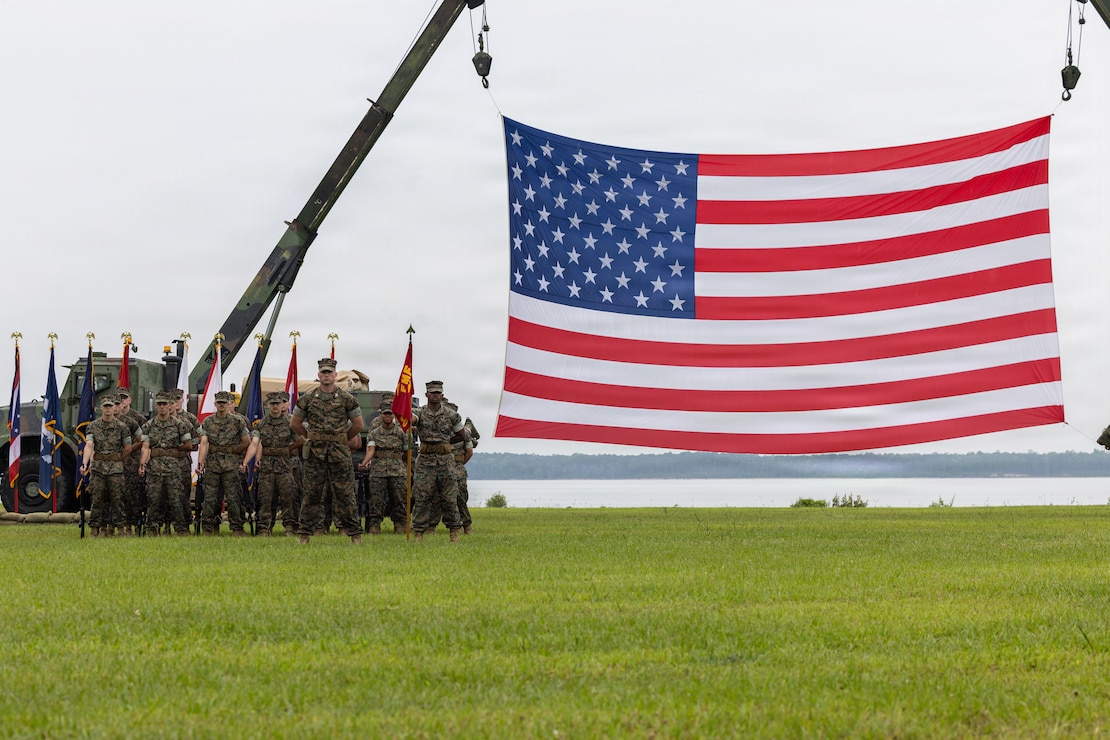 U.S. Marines with 2nd Radio Battalion, II Marine Expeditionary Force Information Group, stand in formation during the 2nd Radio Bn. Change of Command ceremony at Marine Corps Base Camp Lejeune, North Carolina, June 16, 2026. The change of command ceremony symbolizes the passing of authority and responsibility from the offgoing to the oncoming commanding officer. (U.S. Marine Corps photo by Lance Cpl. Ethan Claassen)