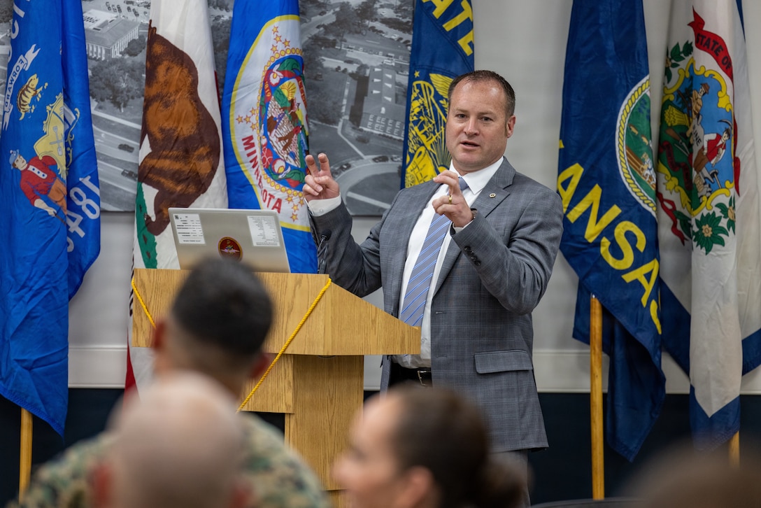 Retired U.S. Marine Corps Lt. Col. Karl W. Schlegel, the first commanding officer of 2nd Network Battalion, Marine Corps Cyberspace Operations Group, gives his remarks during 2nd Network Battalion’s 5th birthday ceremony at Marine Corps Base Camp Lejeune, North Carolina, June 3, 2026. 2nd Network Bn was activated on June 3, 2021, to ensure the operation of a resilient network that enables mission execution in the face of persistent cyber threats. (U.S. Marine Corps photo by Lance Cpl. Alyssa J. DeCrane)