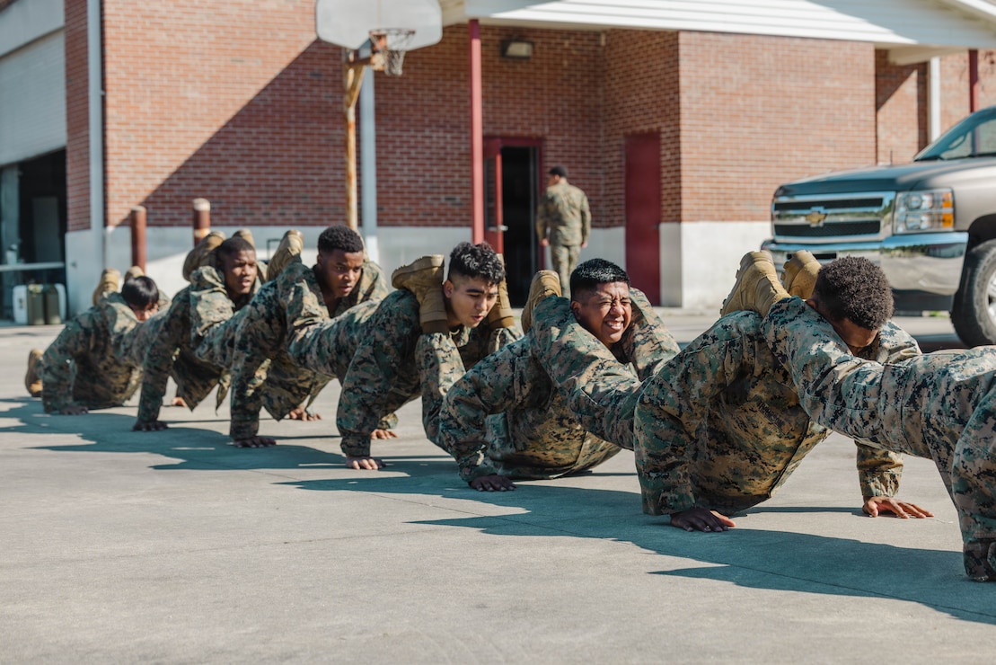 U.S. Marines with 2nd Network Battalion, Marine Corps Cyberspace Operations Group, Marine Corps Forces Cyberspace Command, perform squad push-ups during 2nd Network Battalion’s 5th birthday celebration at Marine Corps Base Camp Lejeune, North Carolina, June 4, 2026. 2nd Network Battalion was activated on June 3, 2021, to ensure the operation of a resilient network that enables mission execution in the face of persistent cyber threats. (U.S. Marine Corps photo by Cpl. Daniela Chicas Torres)