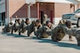 U.S. Marines with 2nd Network Battalion, Marine Corps Cyberspace Operations Group, Marine Corps Forces Cyberspace Command, perform squad push-ups during 2nd Network Battalion’s 5th birthday celebration at Marine Corps Base Camp Lejeune, North Carolina, June 4, 2026. 2nd Network Battalion was activated on June 3, 2021, to ensure the operation of a resilient network that enables mission execution in the face of persistent cyber threats. (U.S. Marine Corps photo by Cpl. Daniela Chicas Torres)