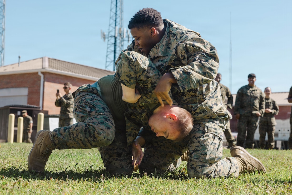 U.S. Marines with 2nd Network Battalion, Marine Corps Cyberspace Operations Group, Marine Corps Forces Cyberspace Command, grapple during 2nd Network Battalion’s 5th birthday celebration at Marine Corps Base Camp Lejeune, North Carolina, June 4, 2026. 2nd Network Battalion was activated on June 3, 2021, to ensure the operation of a resilient network that enables mission execution in the face of persistent cyber threats. (U.S. Marine Corps photo by Cpl Daniela Chicas Torres)
