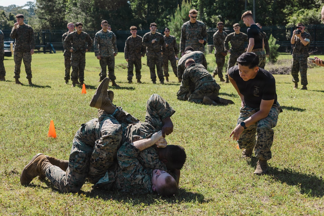 U.S. Marines with 2nd Network Battalion, Marine Corps Cyberspace Operations Group, Marine Corps Forces Cyberspace Command, grapple during 2nd Network Battalion’s 5th birthday celebration at Marine Corps Base Camp Lejeune, North Carolina, June 4, 2026. 2nd Network Battalion was activated on June 3, 2021, to ensure the operation of a resilient network that enables mission execution in the face of persistent cyber threats. (U.S. Marine Corps photo by Cpl Daniela Chicas Torres)