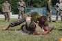 U.S. Marine Corps Gunnery Sgt. Bassey Ekon, right, staff noncommissioned officer in charge, 2nd Network Battalion, Marine Corps Cyberspace Operations Group, Marine Corps Forces Cyberspace Command, grapples during 2nd Network Battalion’s 5th birthday celebration at Marine Corps Base Camp Lejeune, North Carolina, June 4, 2026. 2nd Network Battalion was activated on June 3, 2021, to ensure the operation of a resilient network that enables mission execution in the face of persistent cyber threats. (U.S. Marine Corps photo by Cpl Daniela Chicas Torres)