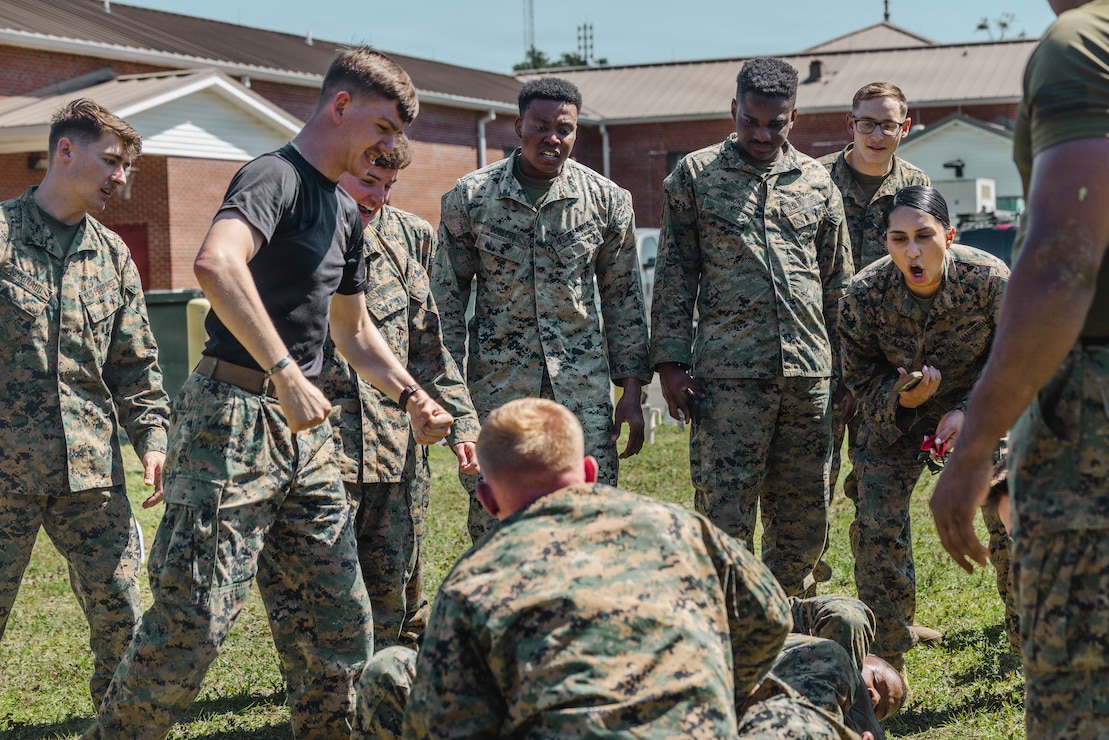 U.S. Marines with 2nd Network Battalion, Marine Corps Cyberspace Operations Group, Marine Corps Forces Cyberspace Command, cheer on their peers during a grappling match during 2nd Network Battalion’s 5th birthday celebration at Marine Corps Base Camp Lejeune, North Carolina, June 4, 2026. 2nd Network Battalion was activated on June 3, 2021, to ensure the operation of a resilient network that enables mission execution in the face of persistent cyber threats. (U.S. Marine Corps photo by Cpl Daniela Chicas Torres)