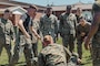 U.S. Marines with 2nd Network Battalion, Marine Corps Cyberspace Operations Group, Marine Corps Forces Cyberspace Command, cheer on their peers during a grappling match during 2nd Network Battalion’s 5th birthday celebration at Marine Corps Base Camp Lejeune, North Carolina, June 4, 2026. 2nd Network Battalion was activated on June 3, 2021, to ensure the operation of a resilient network that enables mission execution in the face of persistent cyber threats. (U.S. Marine Corps photo by Cpl Daniela Chicas Torres)