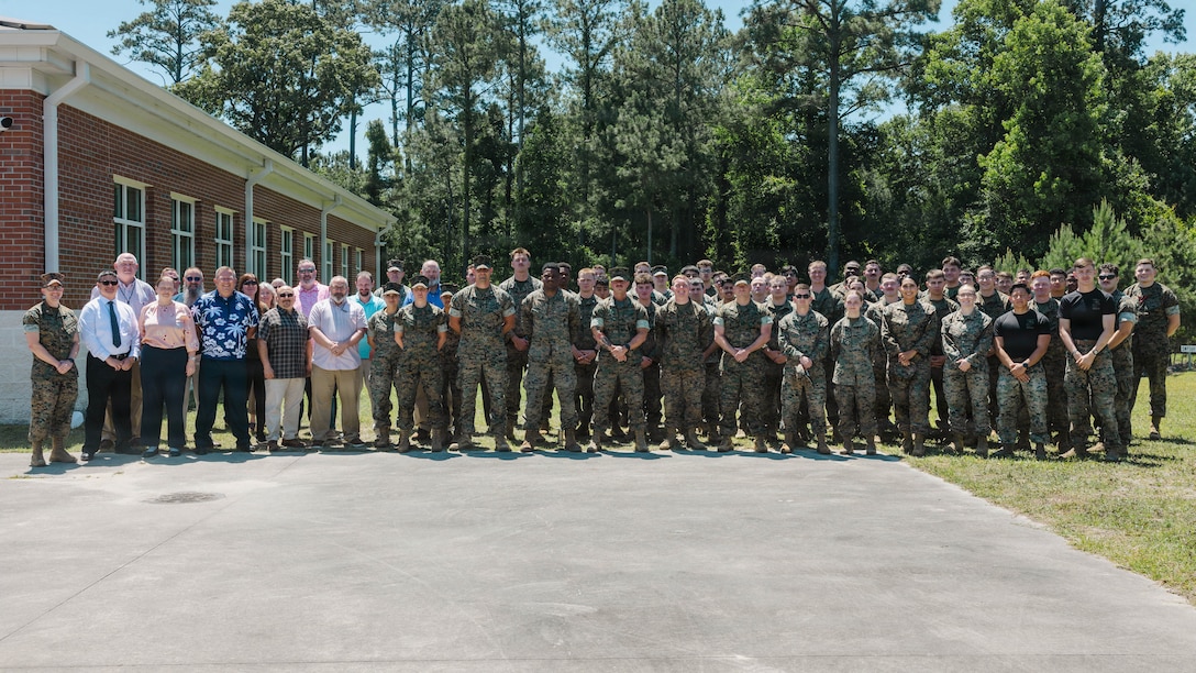 U.S. Marines and civilians with 2nd Network Battalion, Marine Corps Cyberspace Operations Group, Marine Corps Forces Cyberspace Command, pose for a group photo concluding 2nd Network Battalion’s 5th birthday celebration at Marine Corps Base Camp Lejeune, North Carolina, June 4, 2026. 2nd Network Battalion was activated on June 3, 2021, to ensure the operation of a resilient network that enables mission execution in the face of persistent cyber threats. (U.S. Marine Corps photo by Cpl Daniela Chicas Torres)