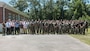 U.S. Marines and civilians with 2nd Network Battalion, Marine Corps Cyberspace Operations Group, Marine Corps Forces Cyberspace Command, pose for a group photo concluding 2nd Network Battalion’s 5th birthday celebration at Marine Corps Base Camp Lejeune, North Carolina, June 4, 2026. 2nd Network Battalion was activated on June 3, 2021, to ensure the operation of a resilient network that enables mission execution in the face of persistent cyber threats. (U.S. Marine Corps photo by Cpl Daniela Chicas Torres)
