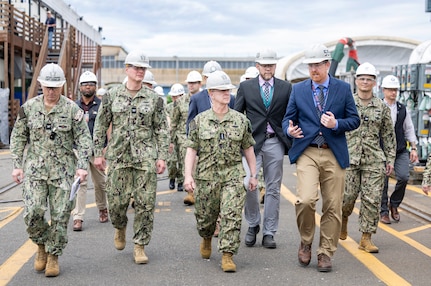 Dave Sweet, Puget Sound Naval Shipyard & Intermediate Maintenance Facility SIOP director, leads Chief of Naval Operations Adm. Daryl Caudle on tours of Dry Docks 3 and 4 during the CNO's command visit to PSNS & IMF, June 3, 2026, in Bremerton, Washington. Caudle was briefed on infrastructure improvements and seismic upgrades during the tour. (U.S. Navy photo by Wendy Hallmark)