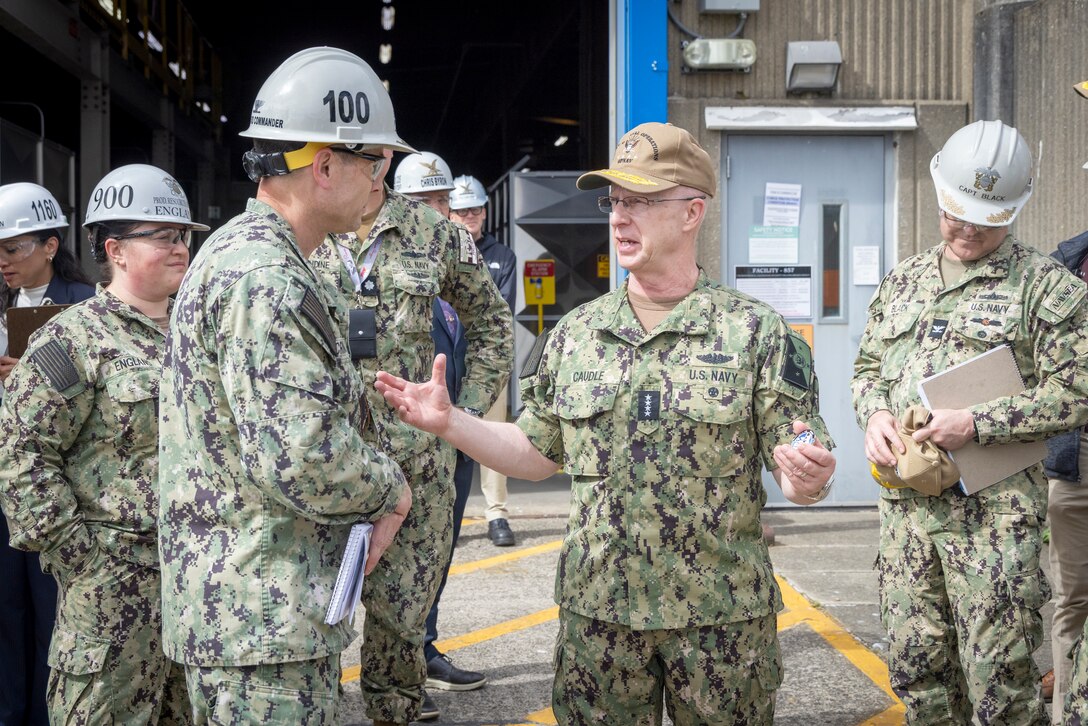 Chief of Naval Operations Adm. Daryl Caudle and Capt. JD Crinklaw, commander, Puget Sound Naval Shipyard & Intermediate Maintenance Facility, exchange command coins at the conclusion of the CNO's visit, June 3, 2026, in Bremerton, Washington. (U.S. Navy photo by Wendy Hallmark)