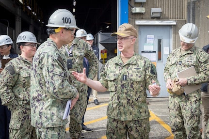 Chief of Naval Operations Adm. Daryl Caudle and Capt. JD Crinklaw, commander, Puget Sound Naval Shipyard & Intermediate Maintenance Facility, exchange command coins at the conclusion of the CNO's visit, June 3, 2026, in Bremerton, Washington. (U.S. Navy photo by Wendy Hallmark)