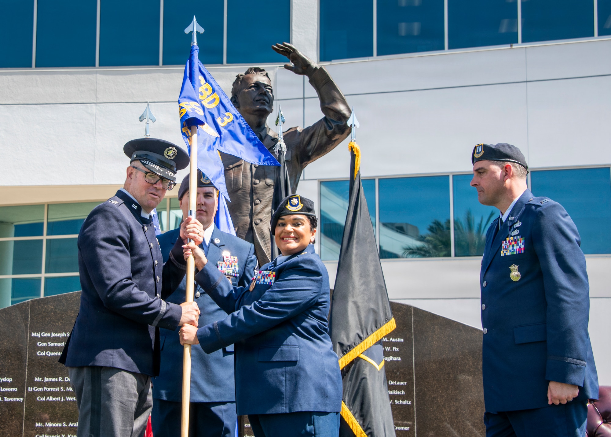 Col. Andrew C. Dermanoski, left, commander of Space Base Delta 3, accepts the 61st Security Forces Squadron guidon from Maj. Naomi Villalobos during a change of command ceremony at Los Angeles Air Force Base, California, June 12, 2026. The change of command passed the responsibility of the 61st Security Forces Squadron to Capt. Joshua D. Baird. The 61st Security Forces Squadron provides security and force protection for four installations, supports Space Systems Command's $10 billion acquisition mission and serves more than 600 military families. (U.S. Space Force photo by Van Ha)