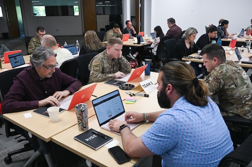 Kessel Run Airmen and government civilians get hands-on training with the future of software development during a two-day course meant to teach them the intricacies of AI, June 3. The Kessel Runners trained to build software applications capable of solving real-world problems. (Official Air Force photo by Richard Blumenstein).
