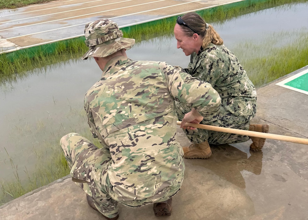 ABIDJAN, Côte d'Ivoire (April 15, 2026) Cmdr. Rebecca Pavlicek, Naval Medical Research Unit (NAMRU) EURAFCENT detachment director, collects samples from a water source as part of environmental health surveillance activities during exercise Flintlock 2026. These efforts support force health protection by identifying potential biological hazards that could impact deployed service members and mission readiness. NAMRU EURAFCENT, part of Navy Medicine Research & Development, conducts research, surveillance and studies of vaccines, therapeutic agents, diagnostic assays and vector control measures in the EUCOM, AFRICOM and CENTCOM Areas of Responsibility to better prevent and treat infectious diseases in support of Navy, Marine Corps and joint U.S. warfighter health, readiness and lethality. (U.S. Navy courtesy photo/Released)