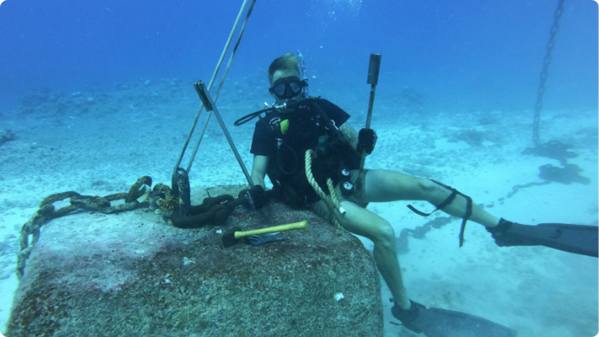 Senior Chief Petty Officer Thomas Hansen conducts Aids-to-Navigation work in the Brooks Channel, Midway Atoll, 2019 (U.S. Coast Guard Photo courtesy of Chief Petty Officer David Bradbury).