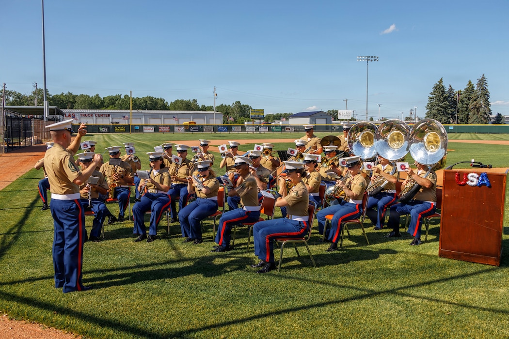 U.S. Marine Corps Cpl. Tyren Davis, a musician with the Quantico Marine Brass Band performs during the post-parade patriotic concert in Appleton, Wisconsin, June 13, 2026. The annual Flag Day Parade is referred to as one of the oldest, largest, Flag Day Parades in the nation with 50,000 patriotic attendees and is led by Marine Forces Reserve Color Guard, Marine Poolees from Recruiting Sub Station Appleton, and the Quantico Marine Band. (U.S. Marine Corps photo by Lance Cpl. Lynsee Avila-Ramirez)