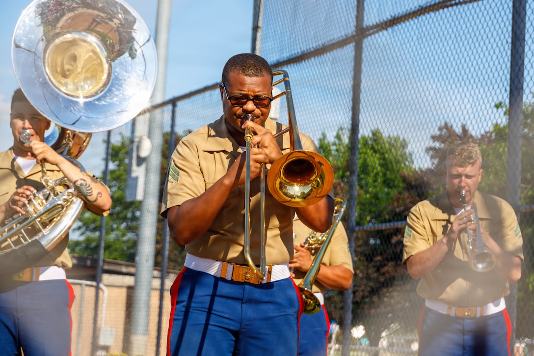U.S. Marine Corps Cpl. Tyren Davis, a musician with the Quantico Marine Brass Band performs during the post-parade patriotic concert in Appleton, Wisconsin, June 13, 2026. The annual Flag Day Parade is referred to as one of the oldest, largest, Flag Day Parades in the nation with 50,000 patriotic attendees and is led by Marine Forces Reserve Color Guard, Marine Poolees from Recruiting Sub Station Appleton, and the Quantico Marine Band. (U.S. Marine Corps photo by Lance Cpl. Lynsee Avila-Ramirez)