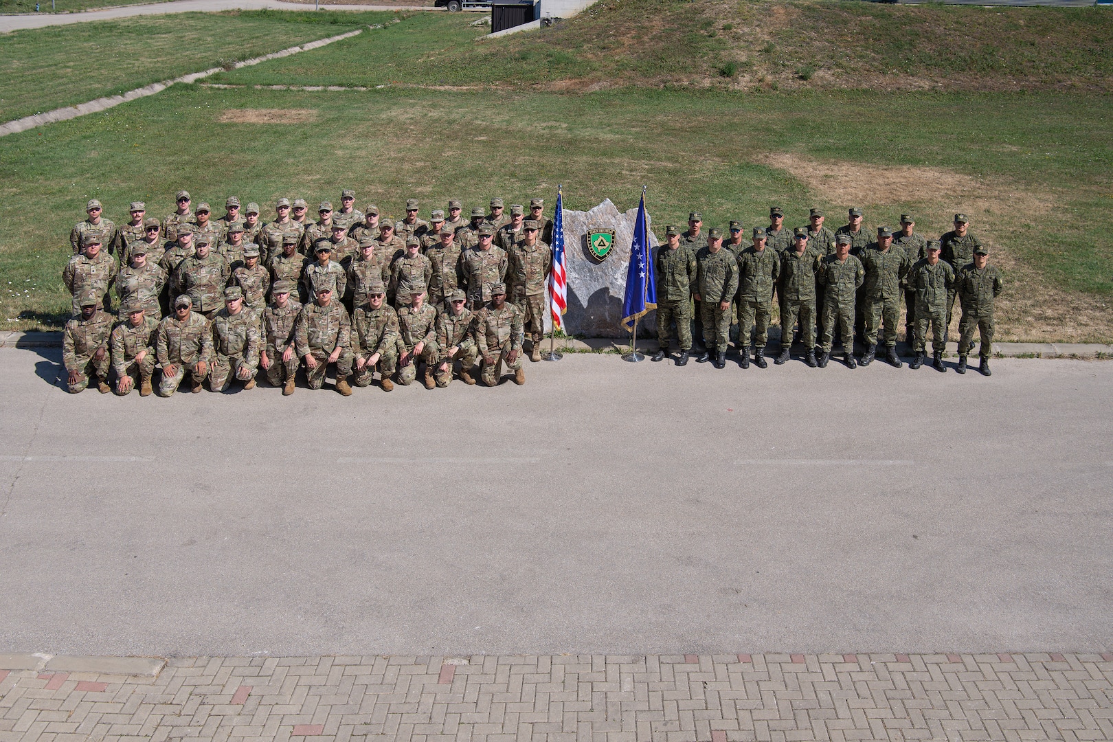 Iowa Air National Guard communication Soldiers and Airmen pose for a group photo alongside Kosovo Security Force communications soldiers during Exercise Sentinel Sica in Kosovo, June 11, 2026.