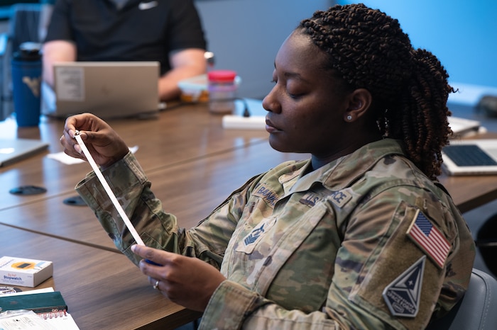 Image of a Guardian looking at a document