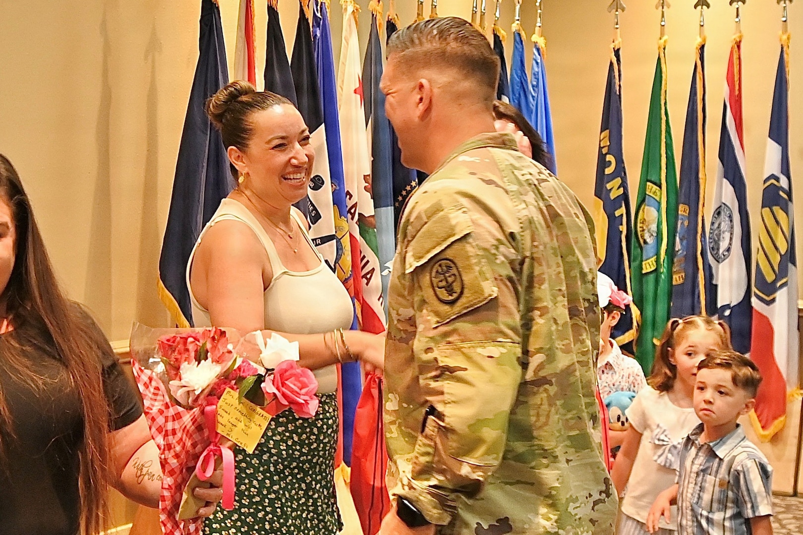BJACH Commander shakes Dental School student's hand at graduation.