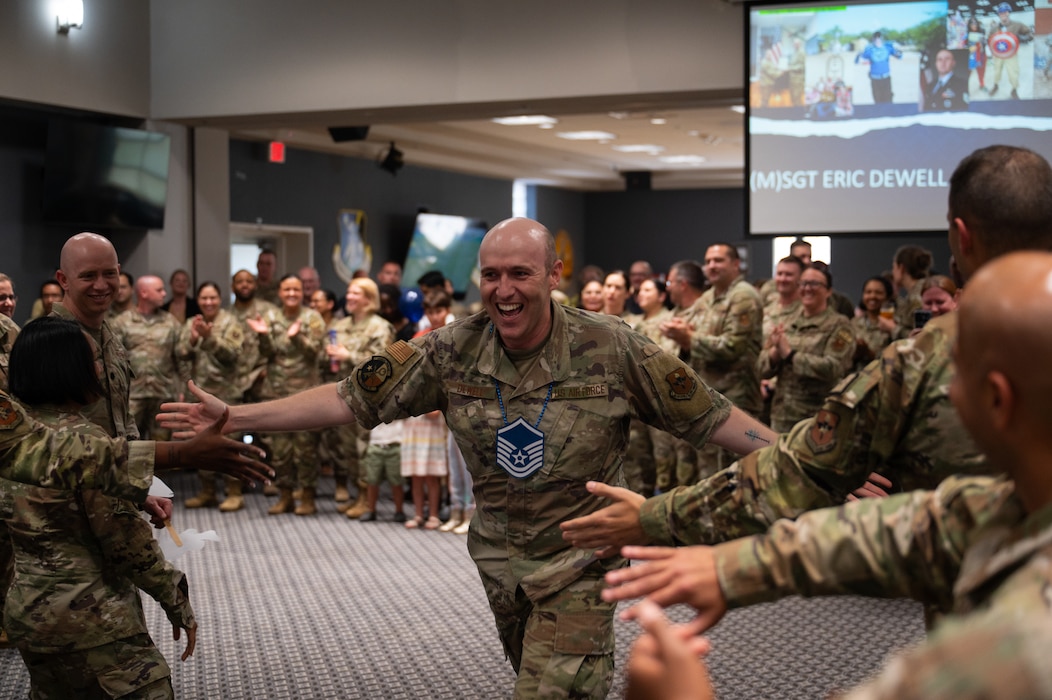 U.S. Air Tech. Sgt. Eric Dewell, 316th Training Squadron master sergeant select, runs the “Gauntlet” during a master sergeant release party at the Powell Event Center, Goodfellow Air Force Base, Texas, June 16, 2026. The ceremony allowed wing leadership, family and friends to recognize the base’s newest master sergeant selects as they transition from technical sergeants to senior noncommissioned officers. (U.S. Air Force photo by Senior Airman Brian Lummus)