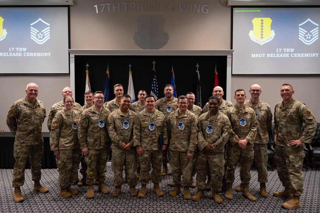 U.S. Air Force technical sergeants assigned to the 17th Training Wing pose for a group photo with Col. Matthew Norton, 17th TRW commander, and Chief Master Sgt. Derek Neill, 17th TRW command chief, after a master sergeant release party at the Powell Event Center, Goodfellow Air Force Base, Texas, June 16, 2026. Promotion to master sergeant marks an Airman's first step into assuming a senior noncommissioned officer's duties. (U.S. Air Force photo by Senior Airman Brian Lummus)