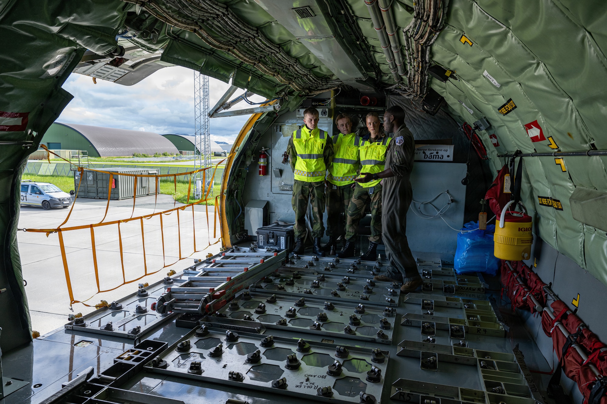 U.S. Air Force Staff Sgt. Mendè Lahens, 351st Air Refueling Squadron boom operator, gives Royal Norwegian Air Force airmen assigned to the 132nd Air Wing, a tour of a KC-135 Stratotanker assigned to the 100th Air Refueling Wing during Ramstein Flag 26 at Ørland Air Base, Norway, June 13, 2026.
