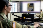 Sgt. Lorelei Hubbard, an administrative noncommissioned officer assigned to the Oklahoma Army National Guard Recruiting and Retention Battalion, uses an artificial intelligence tool to rapidly determine award eligibility for a National Guard member at the RRB headquarters in Oklahoma City on June 17, 2026. The AI tool, developed by Staff Sgt. Herbert Hailey, improves the awards review process, saving hundreds of hours of manual review per Soldier, and could potentially save the OKARNG more than 60,000 hours when applied across the force. (Portions of this image have been blurred for OPSEC/PII purposes)(Oklahoma National Guard photo by Anthony Jones)
