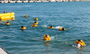 U.S. Airmen assigned to the 183rd Airlift Squadron swim back to shore as part of Aircrew Flight Equipment Water Survival Training in Key West, Florida, June 2, 2025. The final phase of the training reinforces endurance, confidence, and the ability to navigate in open water following an emergency. (U.S. Air National Guard photo by Senior Airman Damara Burrell)