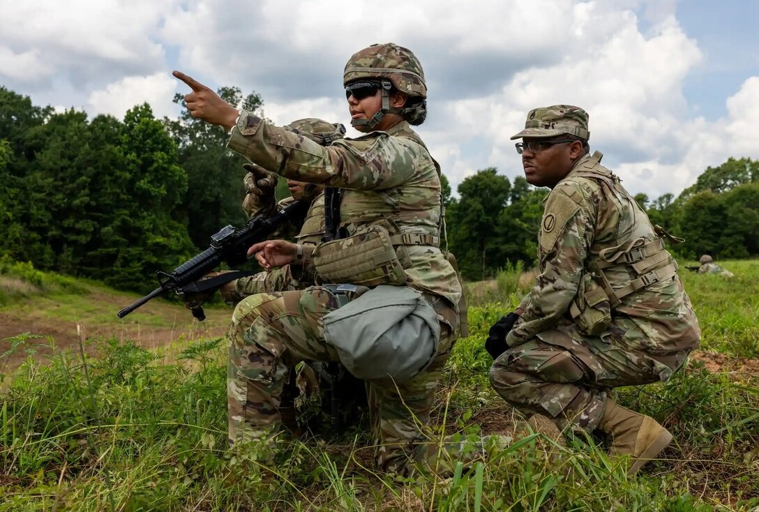An OC/T with the 85th Support Command (right) works alongside a U.S. Army Reserve Soldier during Operation Sentinel Justice, a large training exercise at Camp Shelby Joint Forces Training Center, Mississippi.