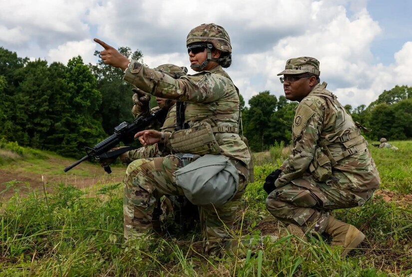 An OC/T with the 85th Support Command (right) works alongside a U.S. Army Reserve Soldier during Operation Sentinel Justice, a large training exercise at Camp Shelby Joint Forces Training Center, Mississippi.