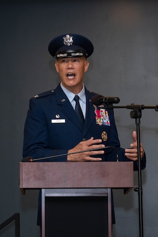 A man in uniform stands at a podium and gives a speech.