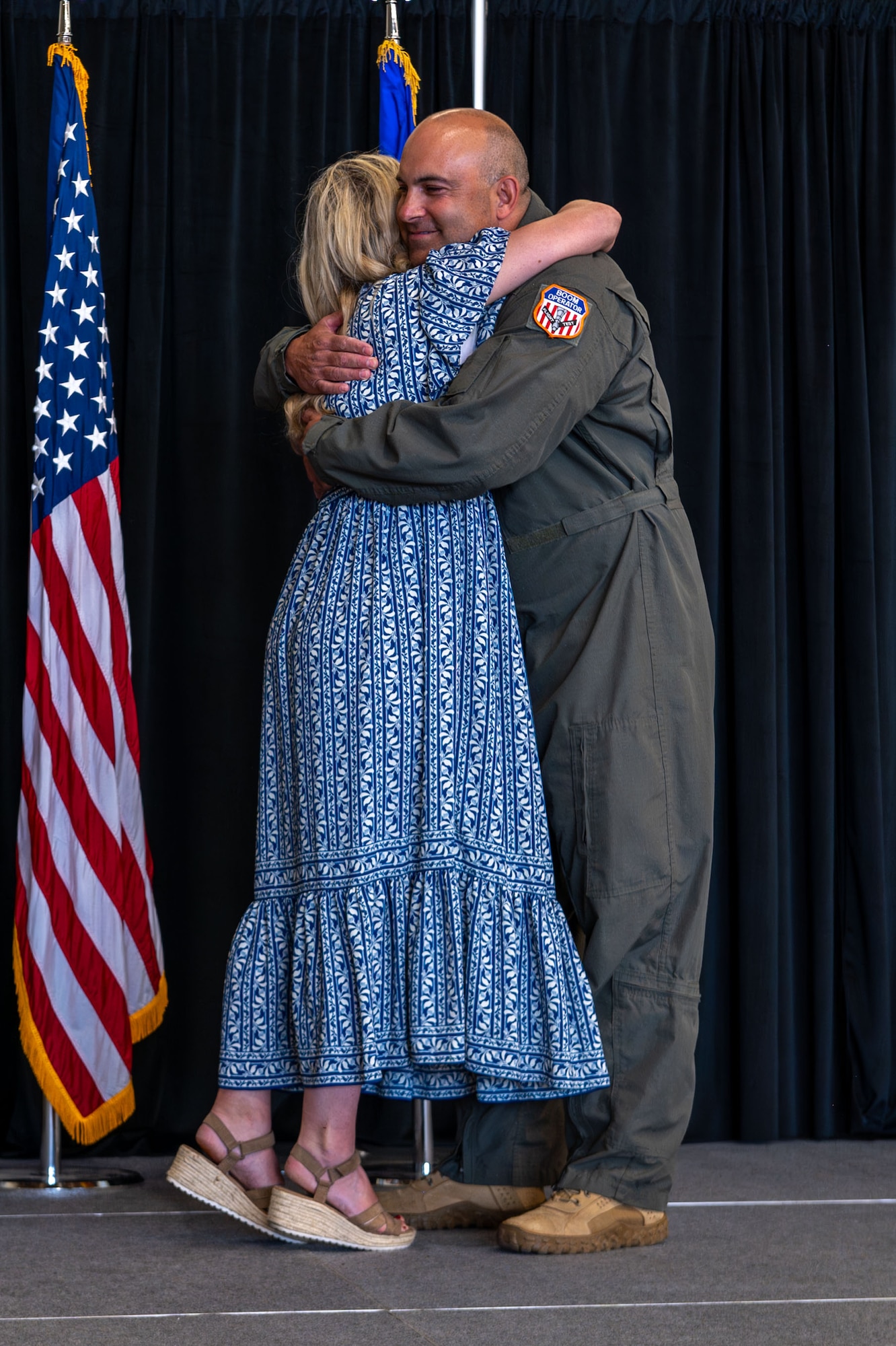 U.S. Air Force Chief Master Sgt, Lindsay Moon, former 92nd Air Refueling Wing command chief, embraces his wife, Sommer Moon, during his retirement ceremony at Fairchild Air Force Base, Washington, June 16, 2026.