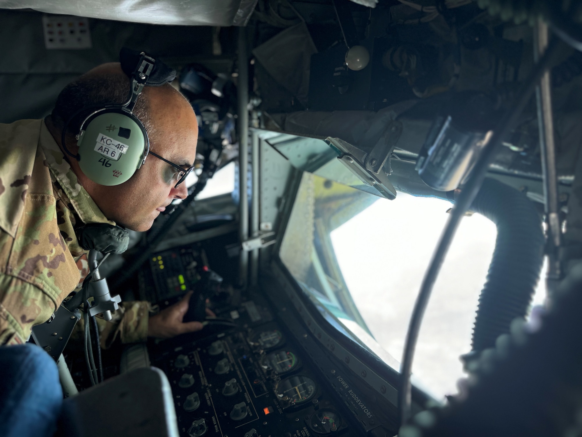 U.S. Air Force Chief Master Sgt. Lindsay Moon, former 92nd Air Refueling Wing command chief, completes an aerial refueling mission onboard a KC-135 Stratotanker.