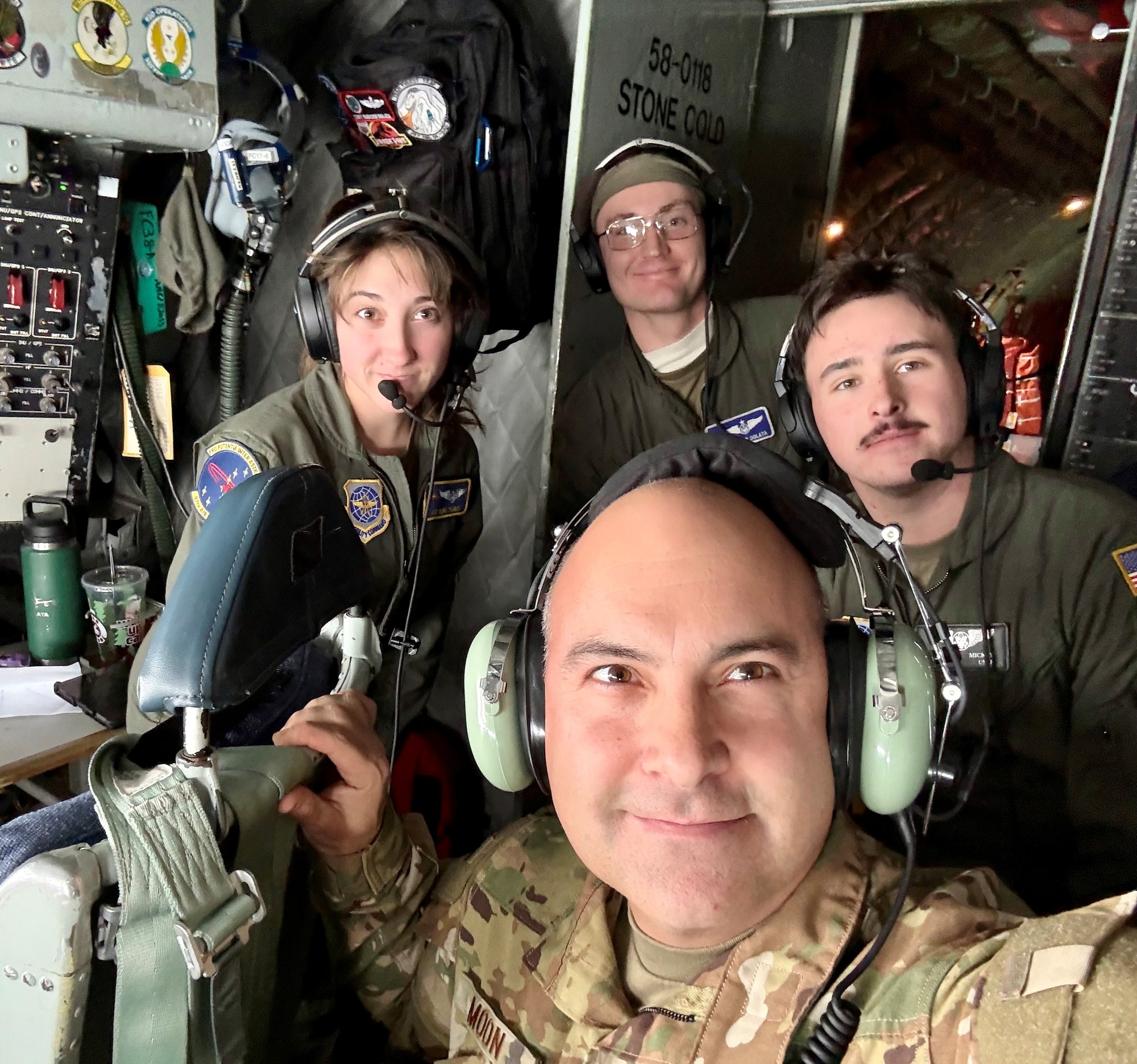 U.S. Air Force Chief Master Sgt. Lindsay Moon, former 92nd Air Refueling Wing command chief, takes a selfie with members of the 92nd Air Refueling Wing.