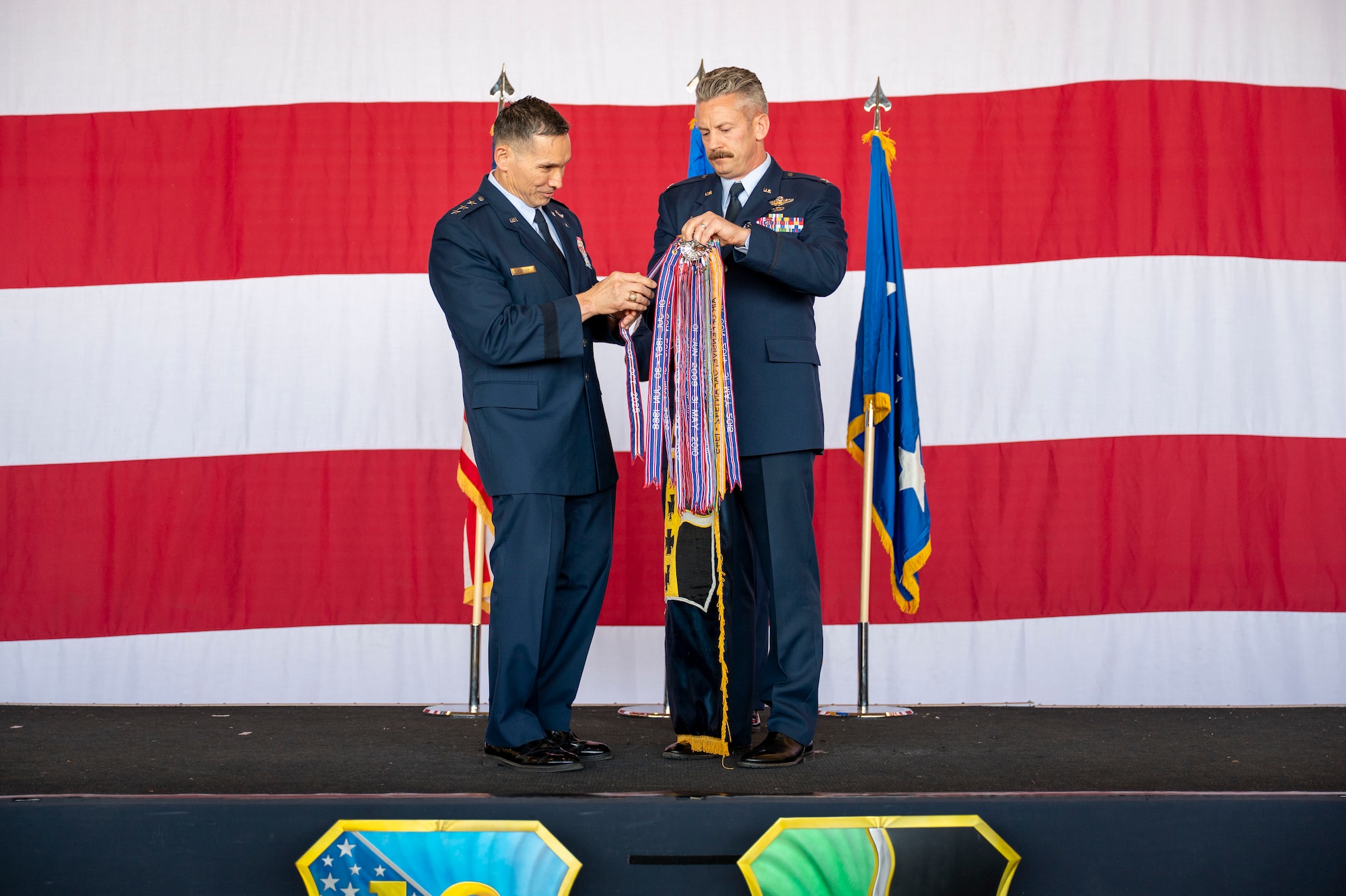 U.S. Air Force Lt. Gen. Thomas Hensley, commander of the Sixteenth Air Force, presents the Gallant Unit Citation to Col. Keagan McLeese, the 9th Reconnaissance Wing commander, during the 9th RW change of command ceremony at Beale Air Force Base, California, June 17, 2026.