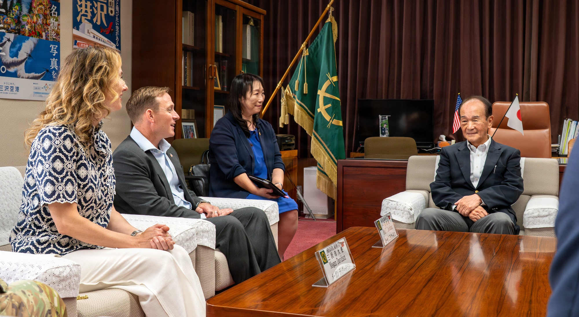 U.S. Air Force Col. Paul Davidson, 35th Fighter Wing commander, and his wife Megan Davidson, speak with Mayor Yoshinori Kohiyama at the city mayor's office in Misawa, Japan, June 16, 2026.