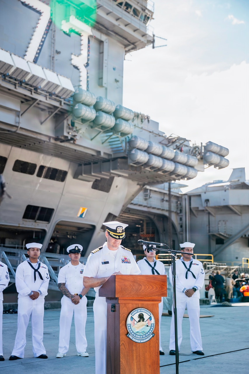 Capt. Nicholas DeLeo, commanding officer of Nimitz-class aircraft carrier USS George Washington (CVN 73) speaks to Gaum media pierside after arriving at Naval Station Guam, June 16, 2025. George Washington is the U.S. Navy’s premiere forward-deployed aircraft carrier, a long-standing symbol of the United States’ commitment to maintaining a free and open Indo-Pacific, while operating alongside allies and partners across the U.S. Navy’s largest numbered fleet. (U.S. Navy photo by Mass Communication Specialist 3rd Class Roselia Garcia)