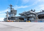 Nimitz-class aircraft carrier USS George Washington (CVN 73) is moored on the pier after arriving at Naval Station Guam, June 16, 2026. The George Washington Carrier Strike Group is operating in the U.S. 7th Fleet area of operations. George Washington is the U.S. Navy’s premiere forward-deployed aircraft carrier, a long-standing symbol of the United States’ commitment to maintaining a free and open Indo-Pacific, while operating alongside allies and partners across the U.S. Navy’s largest numbered fleet. (U.S. Navy photo by Mass Communication Specialist 2nd Class Tyler Crowley)