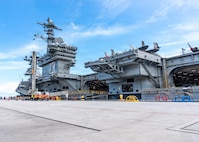 Nimitz-class aircraft carrier USS George Washington (CVN 73) is moored on the pier after arriving at Naval Station Guam, June 16, 2026. The George Washington Carrier Strike Group is operating in the U.S. 7th Fleet area of operations. George Washington is the U.S. Navy’s premiere forward-deployed aircraft carrier, a long-standing symbol of the United States’ commitment to maintaining a free and open Indo-Pacific, while operating alongside allies and partners across the U.S. Navy’s largest numbered fleet. (U.S. Navy photo by Mass Communication Specialist 2nd Class Tyler Crowley)